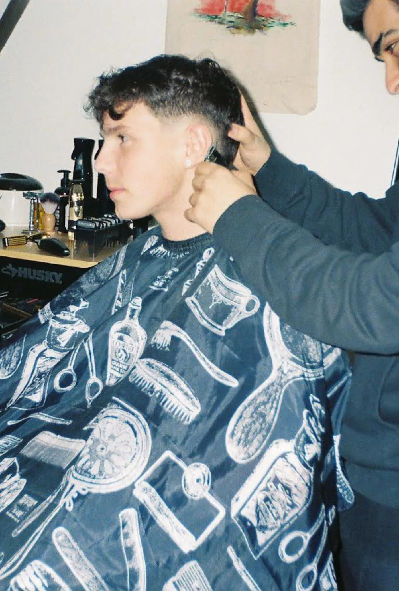 Ethan Quintela in the early days of cutting hair